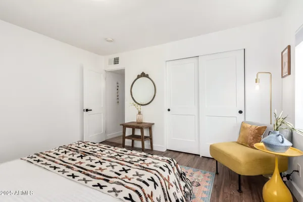 a view of an house with backyard outdoor seating and hardwood