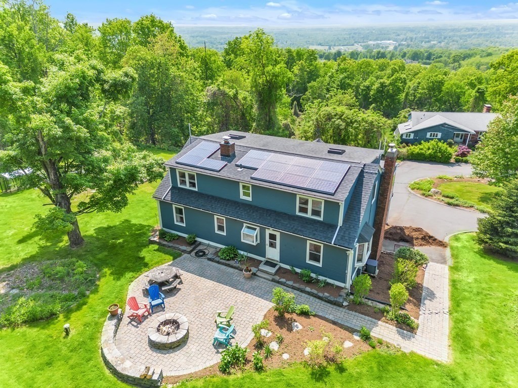 an aerial view of a house with garden space and balcony