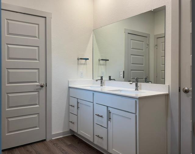 Dual vanity with bright white countertops and modern fixtures creates a crisp, clean aesthetic.