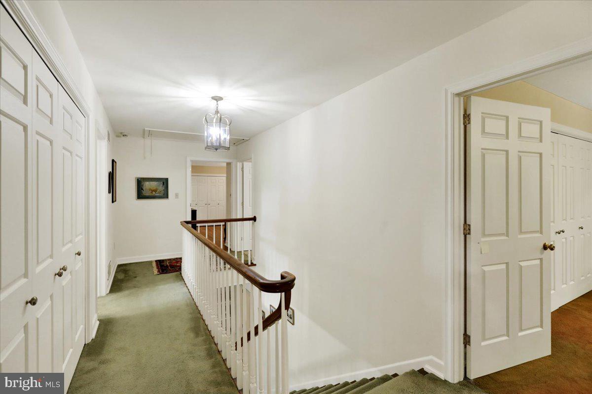 154 Deer Hill Road Reading, PA 19607 - Photo 34 of 97 a view of a hallway with wooden floor and staircase