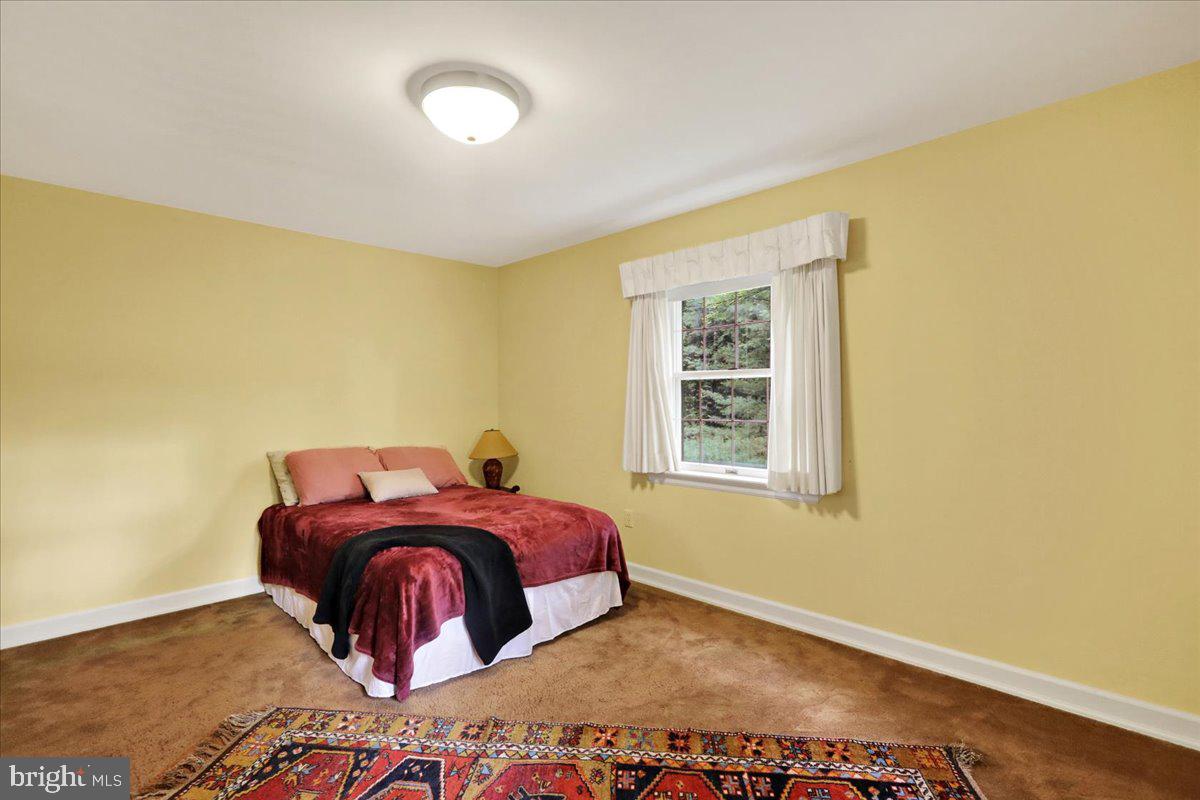 154 Deer Hill Road Reading, PA 19607 - Photo 35 of 97 a bed sitting in a bedroom next to a window