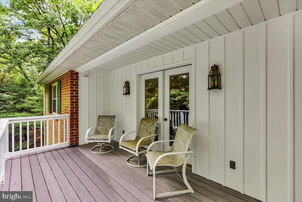 154 Deer Hill Road Reading, PA 19607 - Photo 43 of 97 a view of a patio with table and chairs and wooden floor