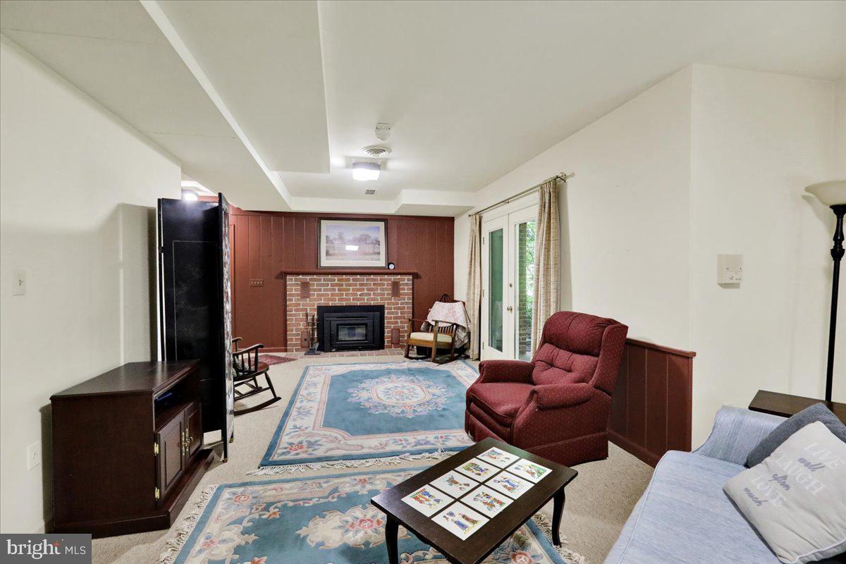 154 Deer Hill Road Reading, PA 19607 - Photo 48 of 97 a living room with furniture a fireplace and a flat screen tv