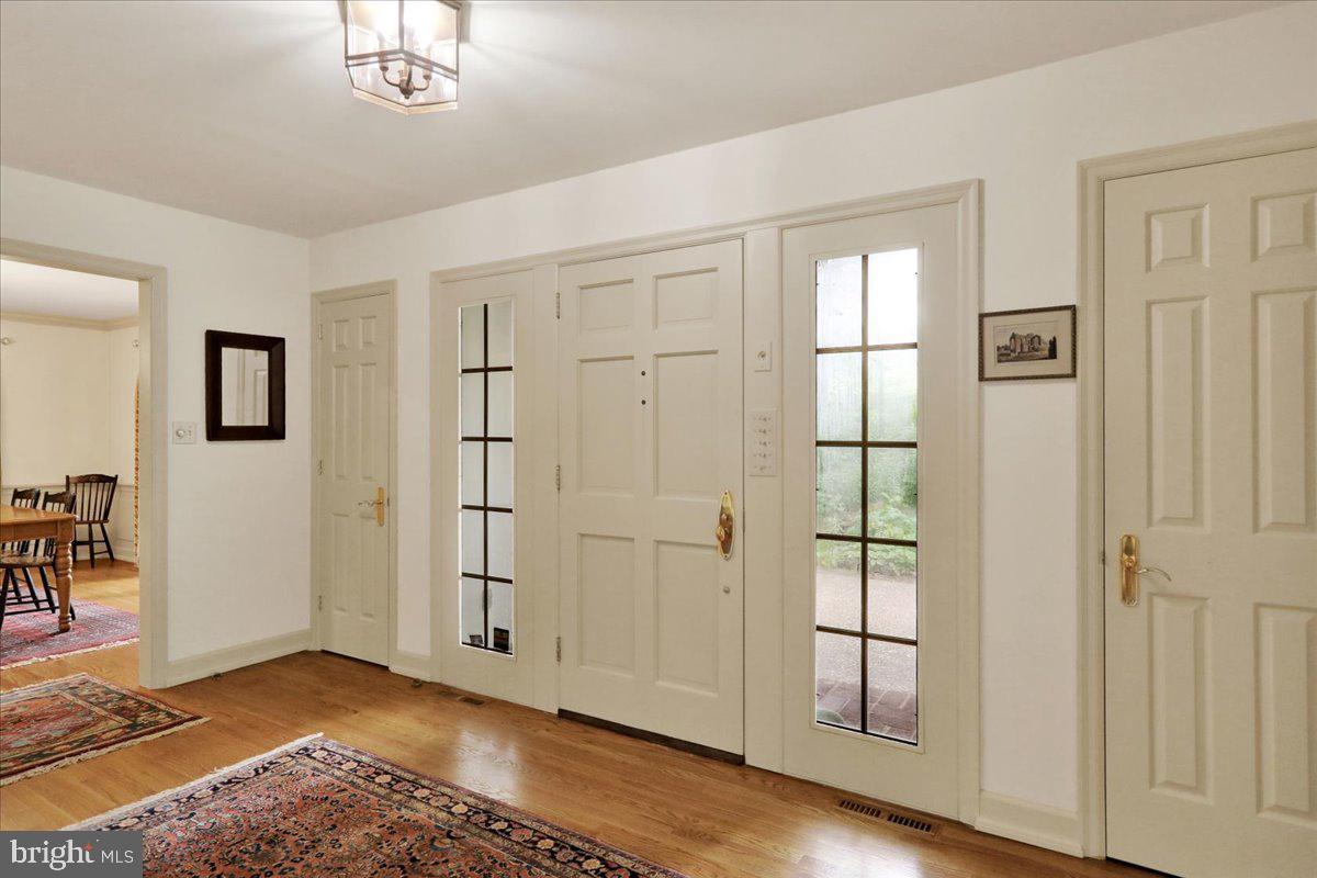 154 Deer Hill Road Reading, PA 19607 - Photo 7 of 97 a view of an empty room with wooden floor and a window
