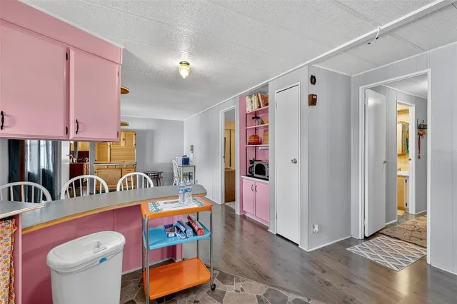 a view of lobby with furniture and wooden floor