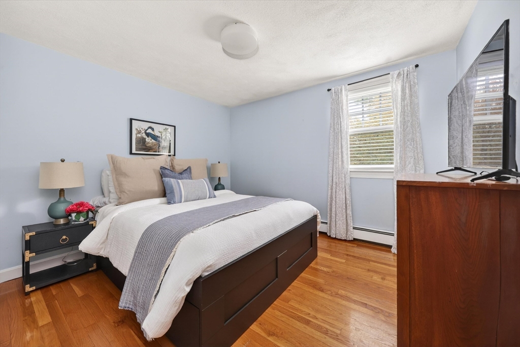 59 First Parish Road Norwell, MA 02061 - Photo 22 of 37 a bedroom with bed and window