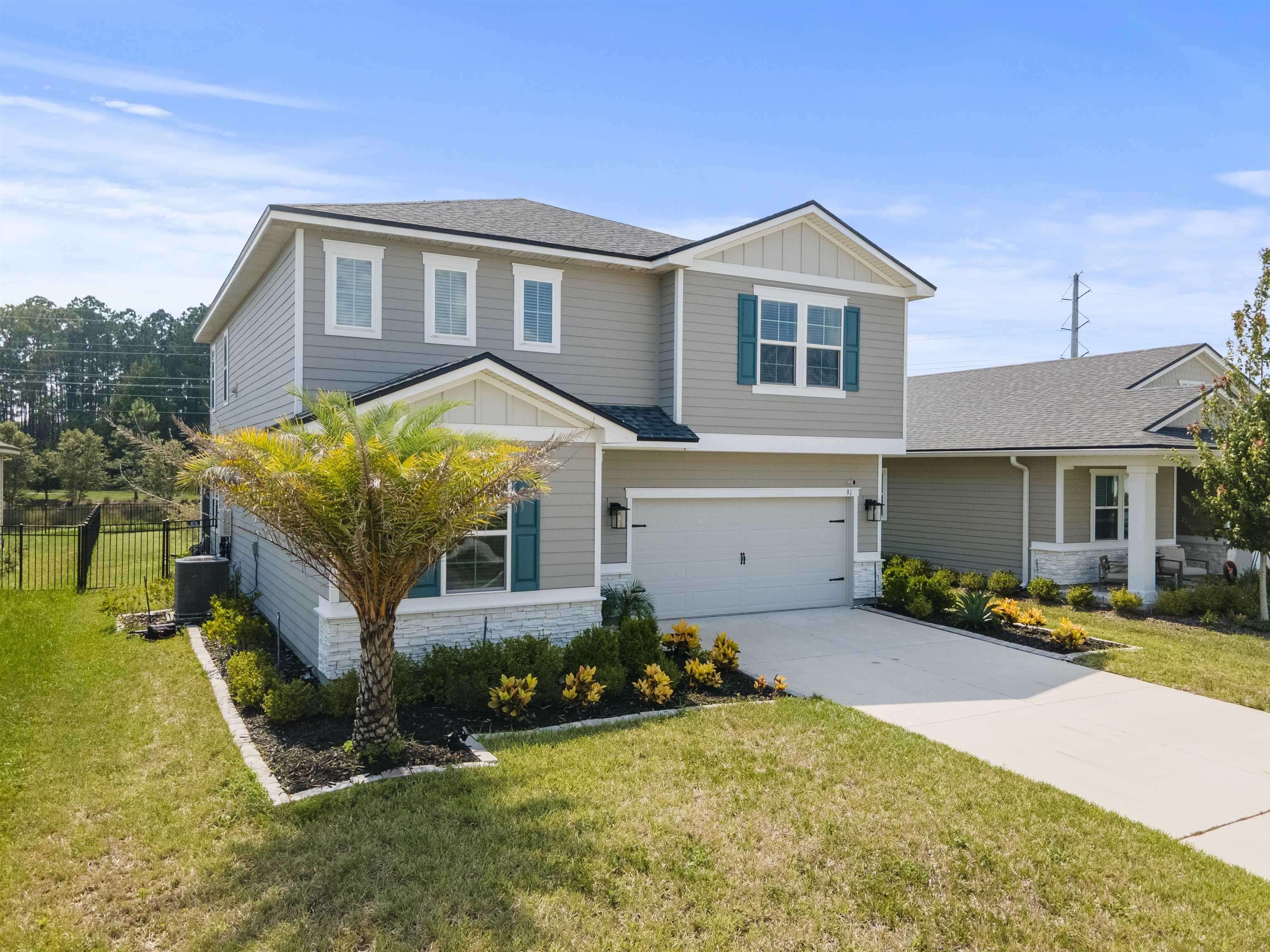 91 Pepperpike Way Street St. Augustine, FL 32092 - Photo 3 of 79 a front view of a house with a yard
