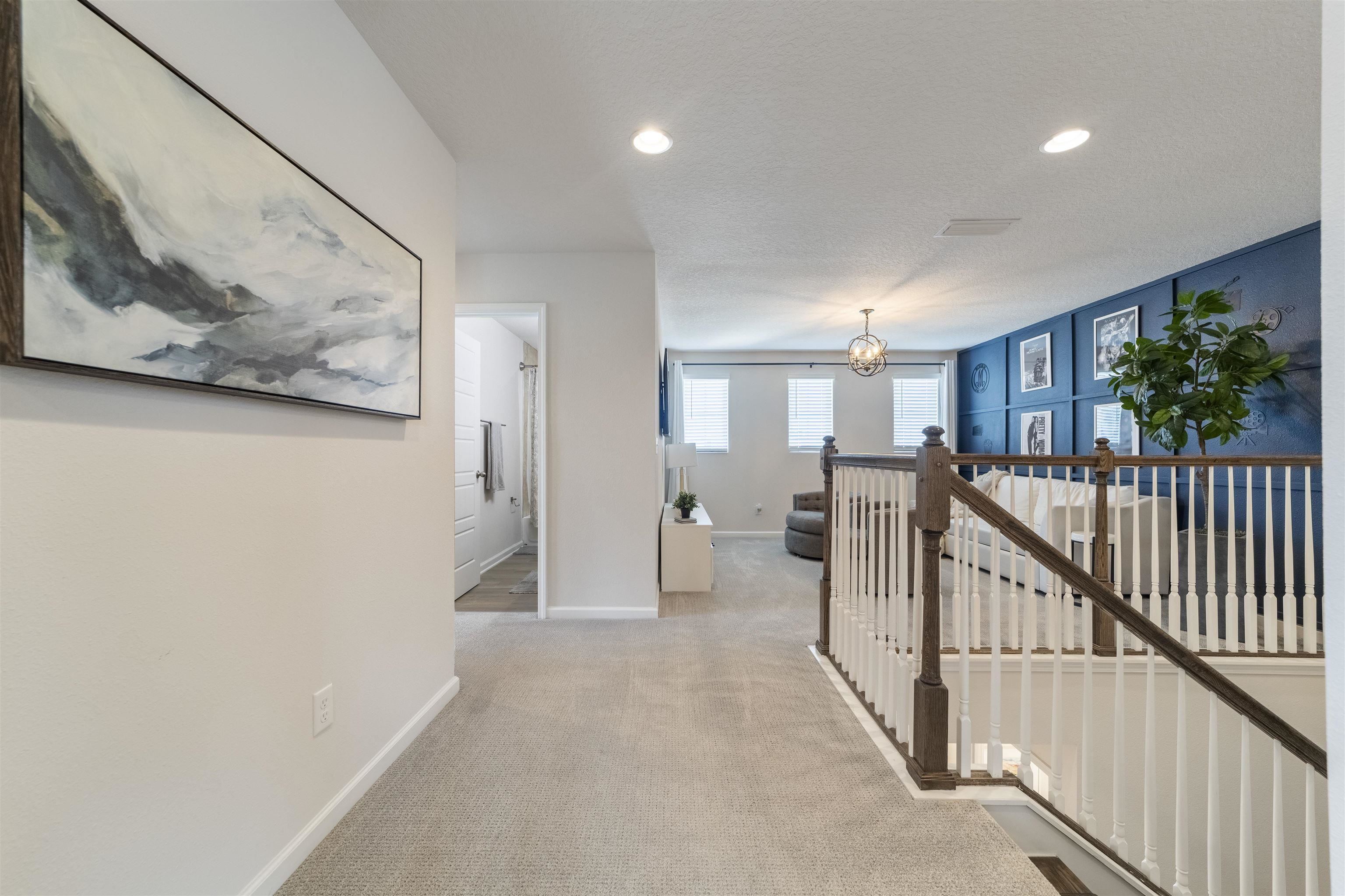 91 Pepperpike Way Street St. Augustine, FL 32092 - Photo 29 of 79 Hall with an upstairs landing, light carpet, recessed lighting, and a chandelier