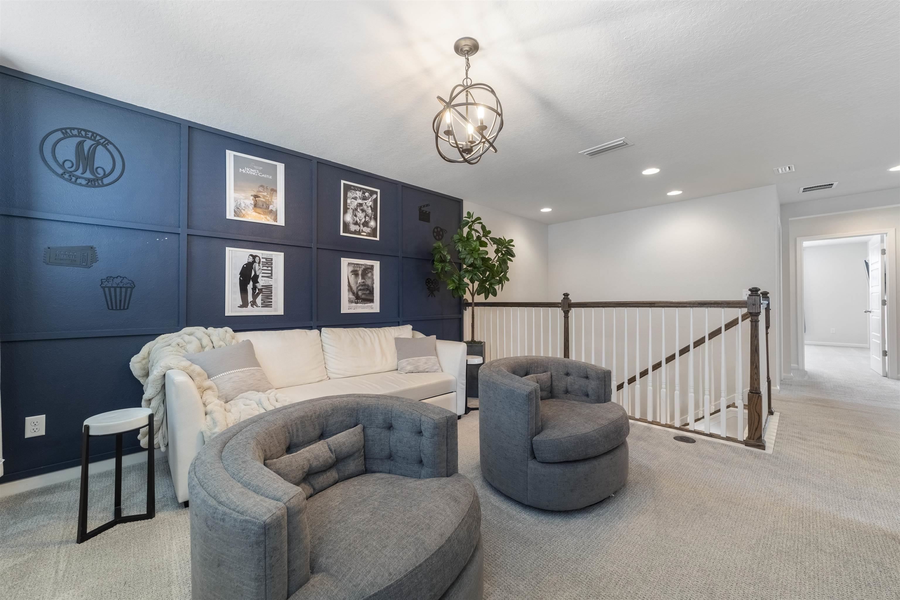 91 Pepperpike Way Street St. Augustine, FL 32092 - Photo 33 of 79 Living area featuring an upstairs landing, carpet flooring, a decorative wall, recessed lighting, and a chandelier