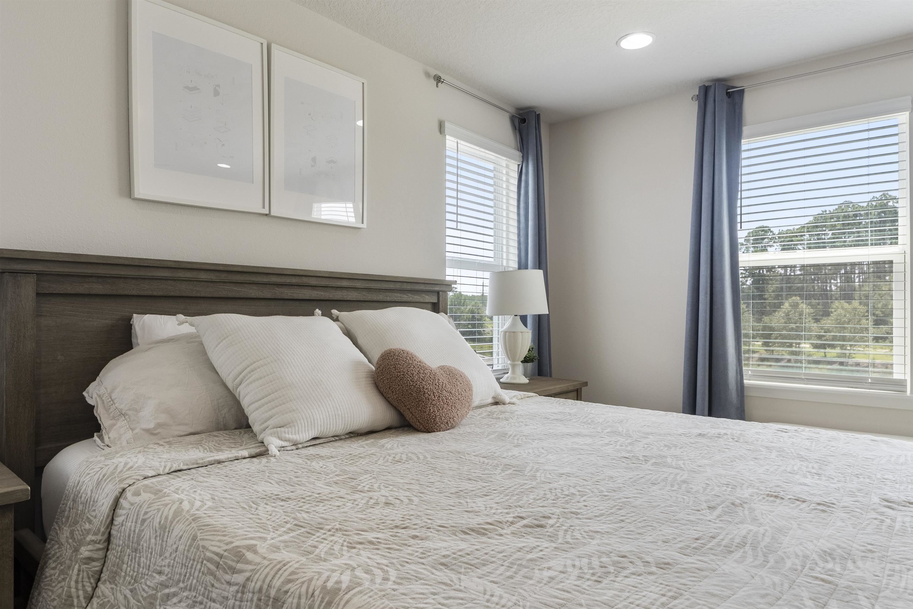 91 Pepperpike Way Street St. Augustine, FL 32092 - Photo 39 of 79 a large bed sitting in a bedroom next to a window