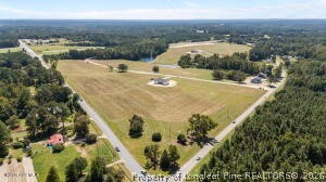 395 Atkins Road Cameron, NC 28326 - Photo 4 of 5 a view of a lake with a mountain