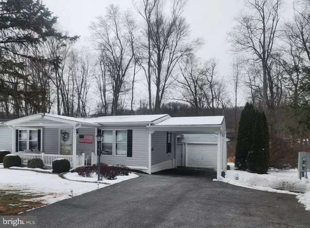a view of a white house with a large windows