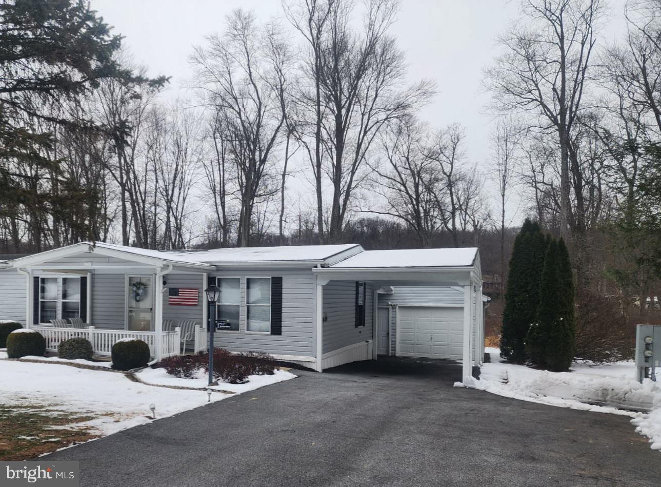 a view of a white house with a large windows