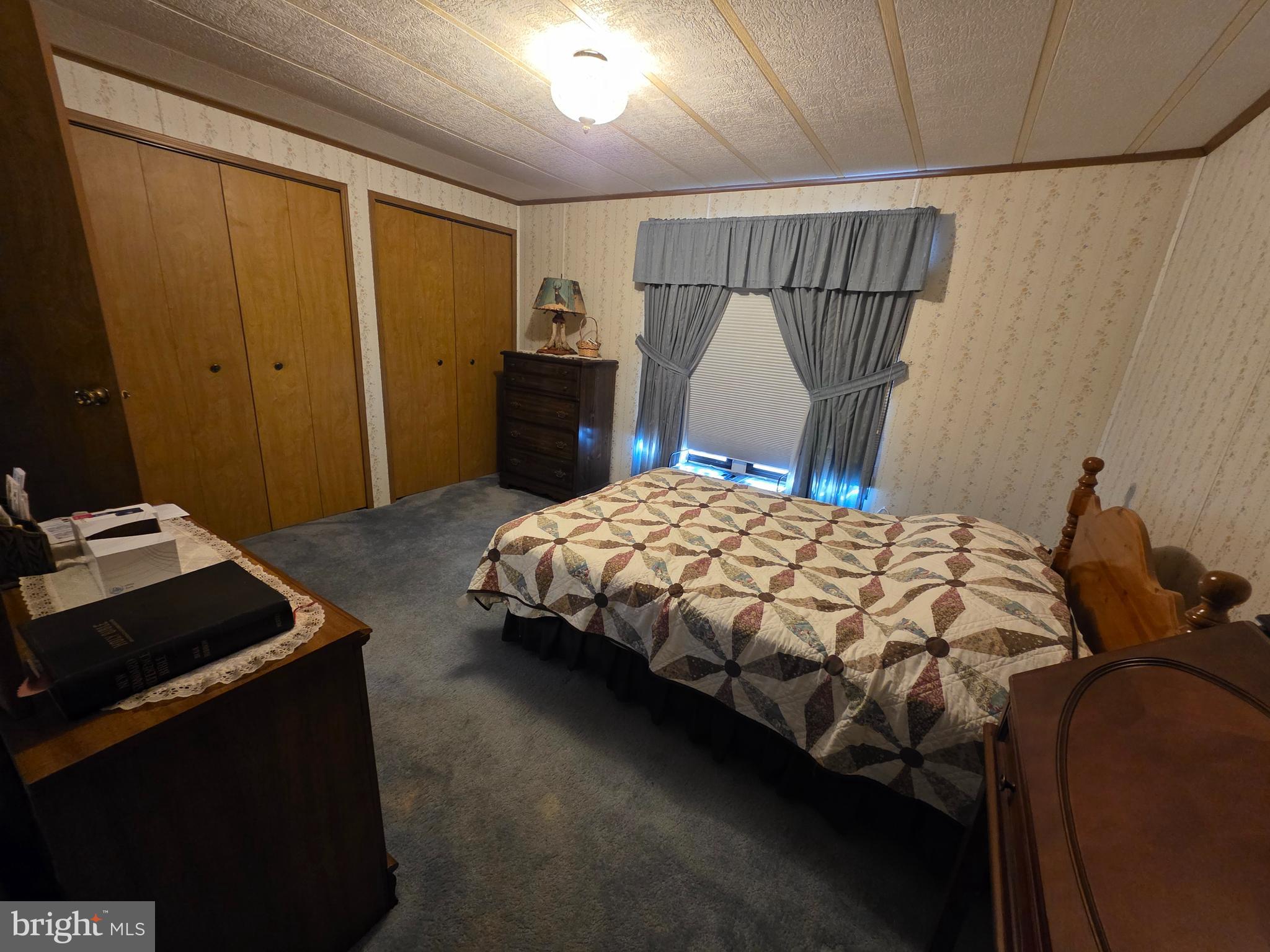 210 Maple Avenue Manheim, PA 17545 - Photo 4 of 10 a bedroom with a bed and a dresser