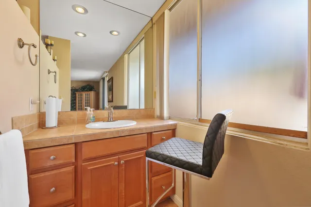 a view of a hallway with furniture and window