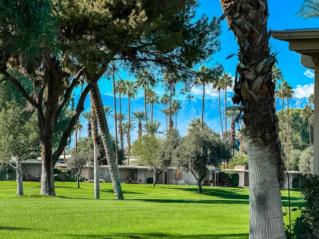 a view of a house with a flower garden