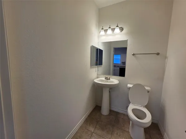 a bathroom with a toilet and a sink
