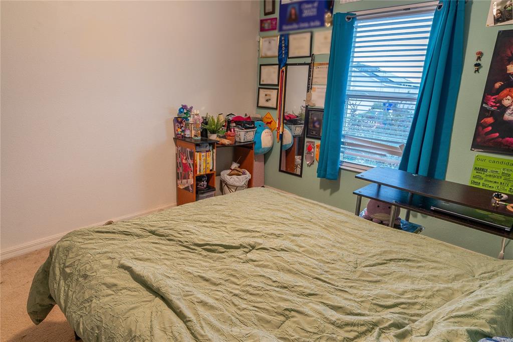 4563 Orchard Grove Road St. Cloud, FL 34772 - Photo 50 of 51 a bed sitting in a bedroom next to a window