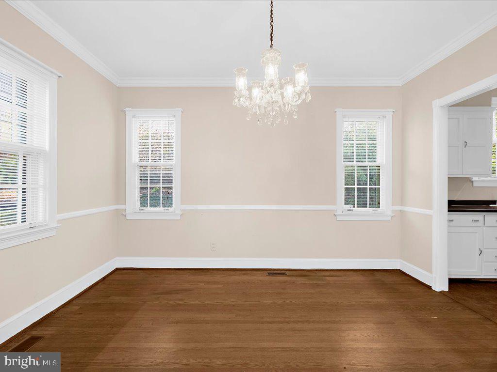 1201 Noyes Drive Silver Spring, MD 20910 - Photo 11 of 35 a view of wooden floor and windows in the room