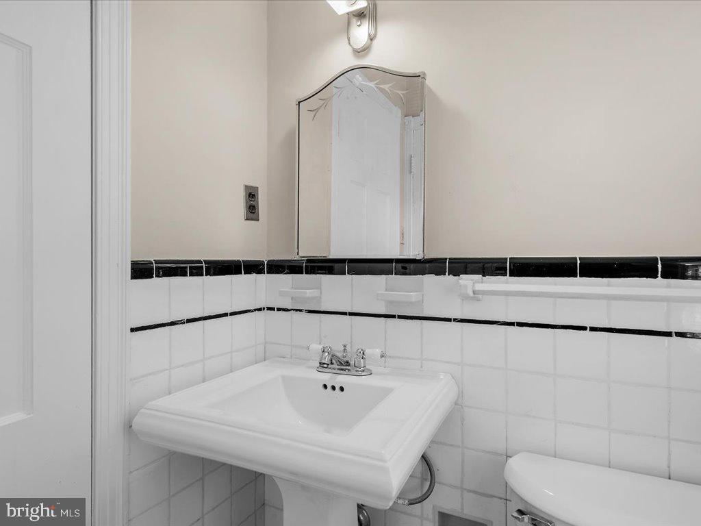 1201 Noyes Drive Silver Spring, MD 20910 - Photo 17 of 35 a bathroom with a sink and a toilet