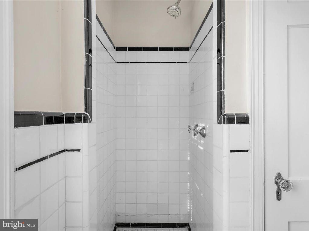 1201 Noyes Drive Silver Spring, MD 20910 - Photo 18 of 35 a bathroom with a shower and a mirror