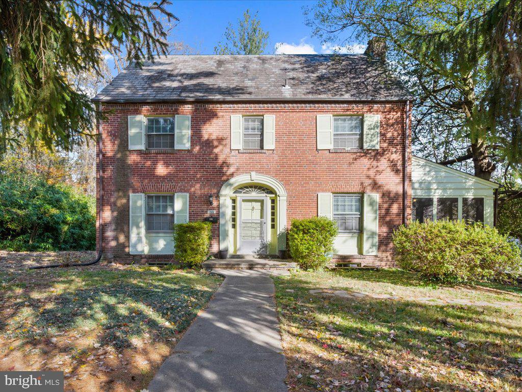1201 Noyes Drive Silver Spring, MD 20910 - Photo 2 of 35 a front view of a house with garden