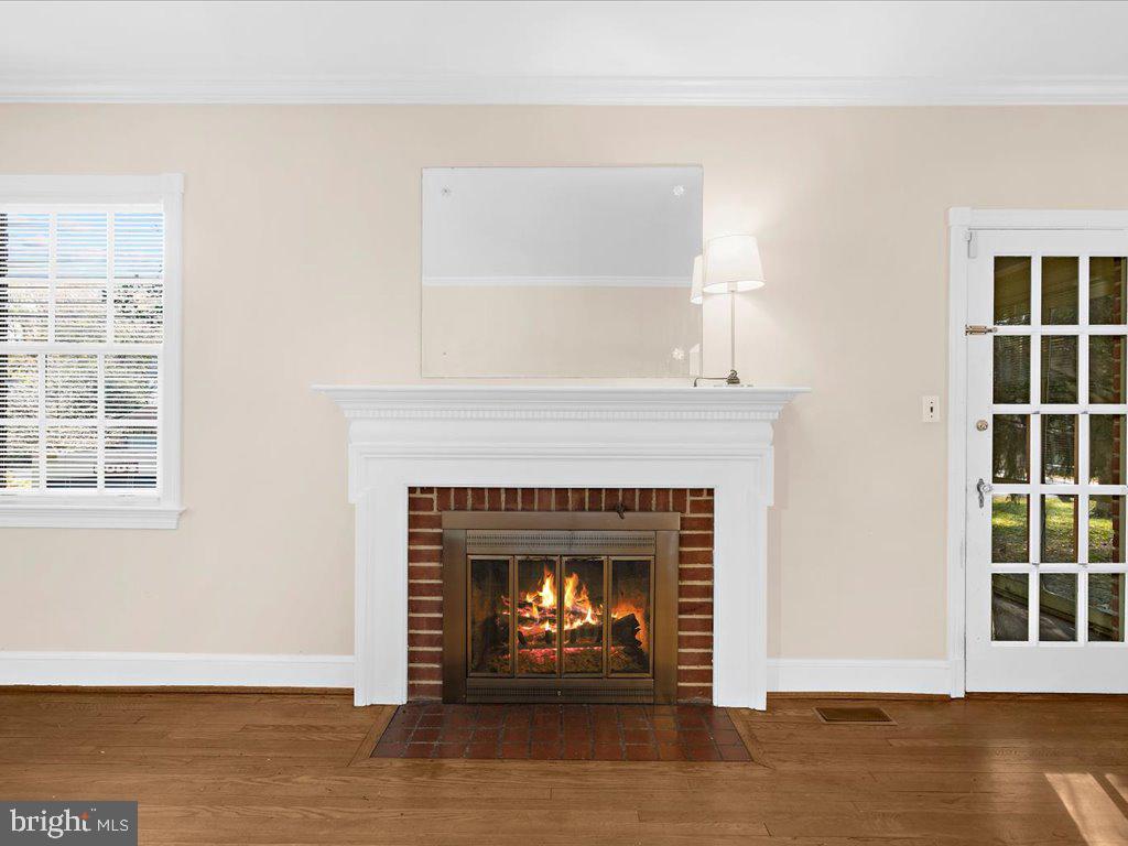 1201 Noyes Drive Silver Spring, MD 20910 - Photo 8 of 35 a living room with a fireplace and a window