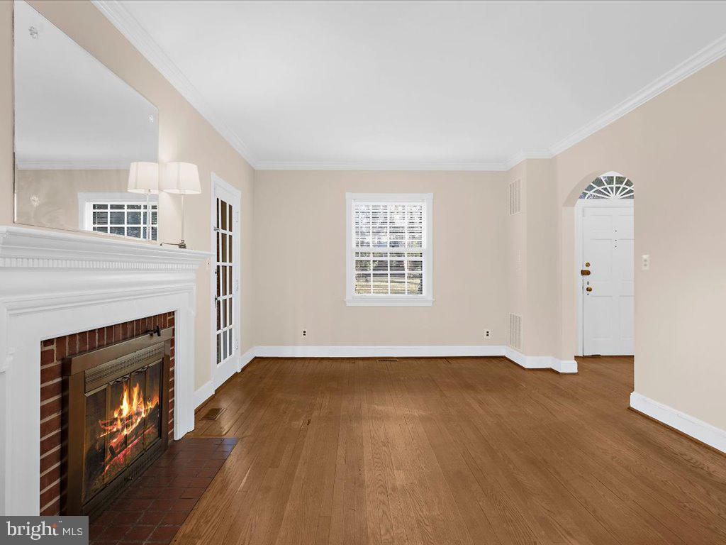 1201 Noyes Drive Silver Spring, MD 20910 - Photo 9 of 35 an empty room with windows and fireplace