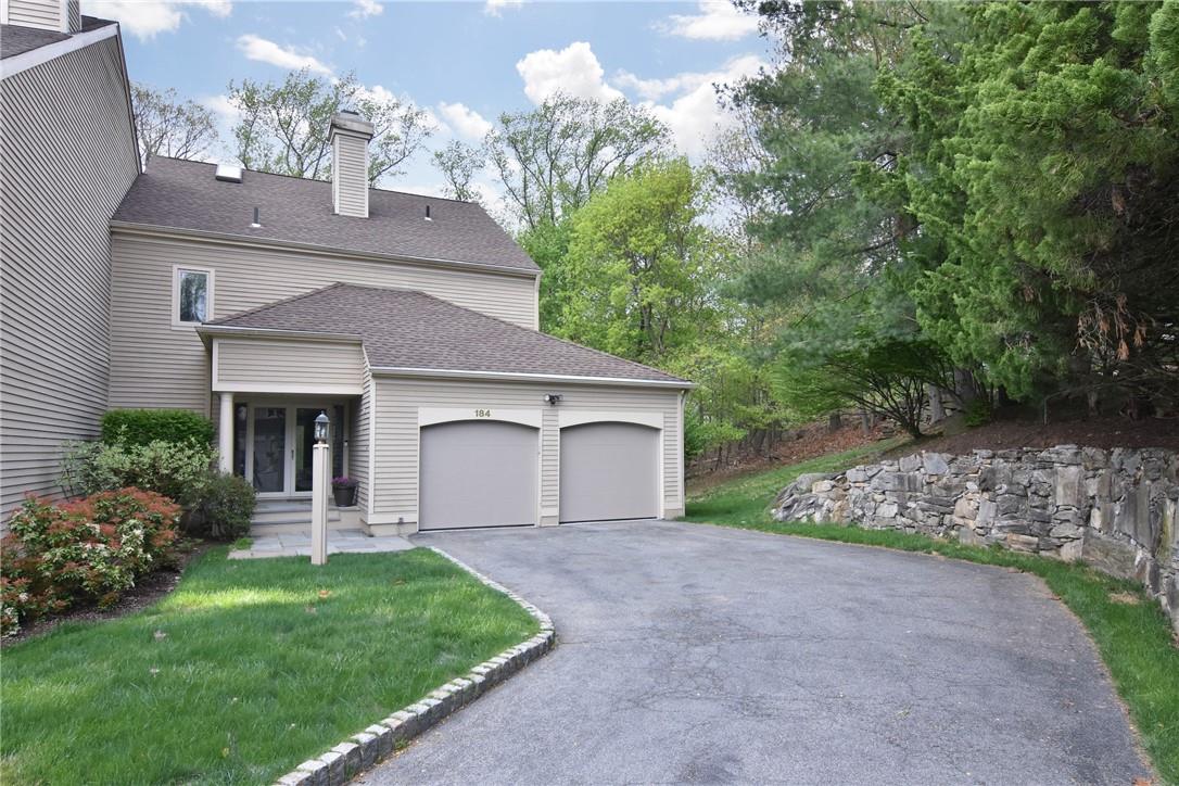 Exterior Front View - End Unit, Two Car Garage, 4 Car Driveway