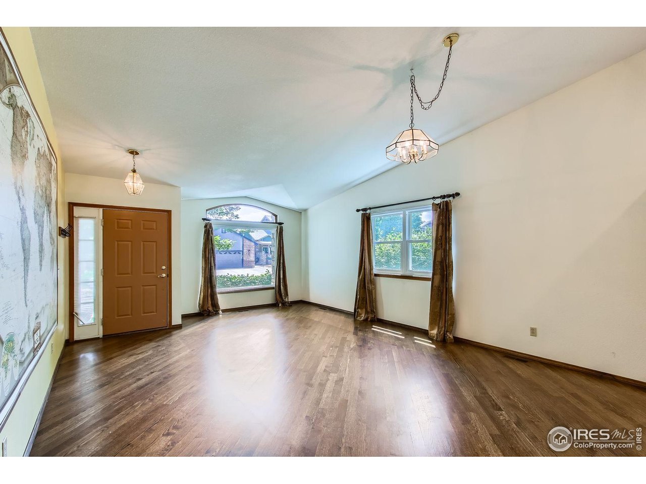 10947 West 100th Drive Broomfield, CO 80021 - Photo 18 of 38 a view of an empty room with wooden floor and a window