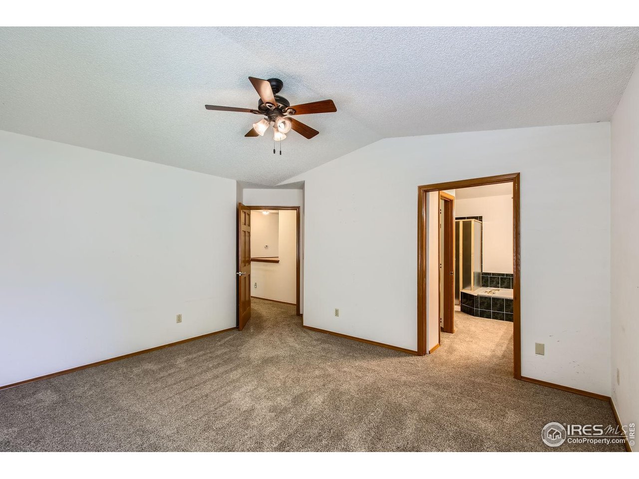 10947 West 100th Drive Broomfield, CO 80021 - Photo 22 of 38 a view of empty room with ceiling fan