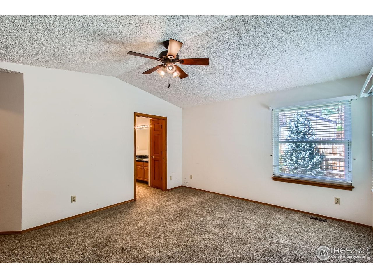 10947 West 100th Drive Broomfield, CO 80021 - Photo 23 of 38 a view of an empty room with a window