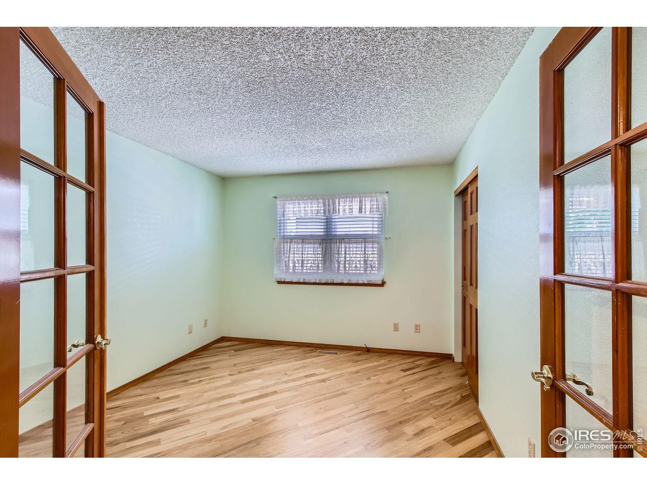 10947 West 100th Drive Broomfield, CO 80021 - Photo 24 of 38 a view of an empty room with a window