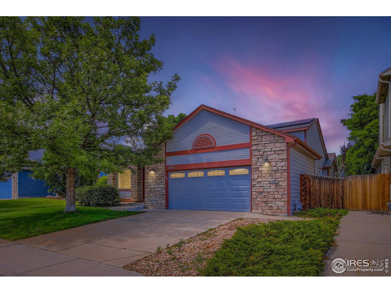 10947 West 100th Drive Broomfield, CO 80021 - Photo 3 of 38 a front view of a house with a yard