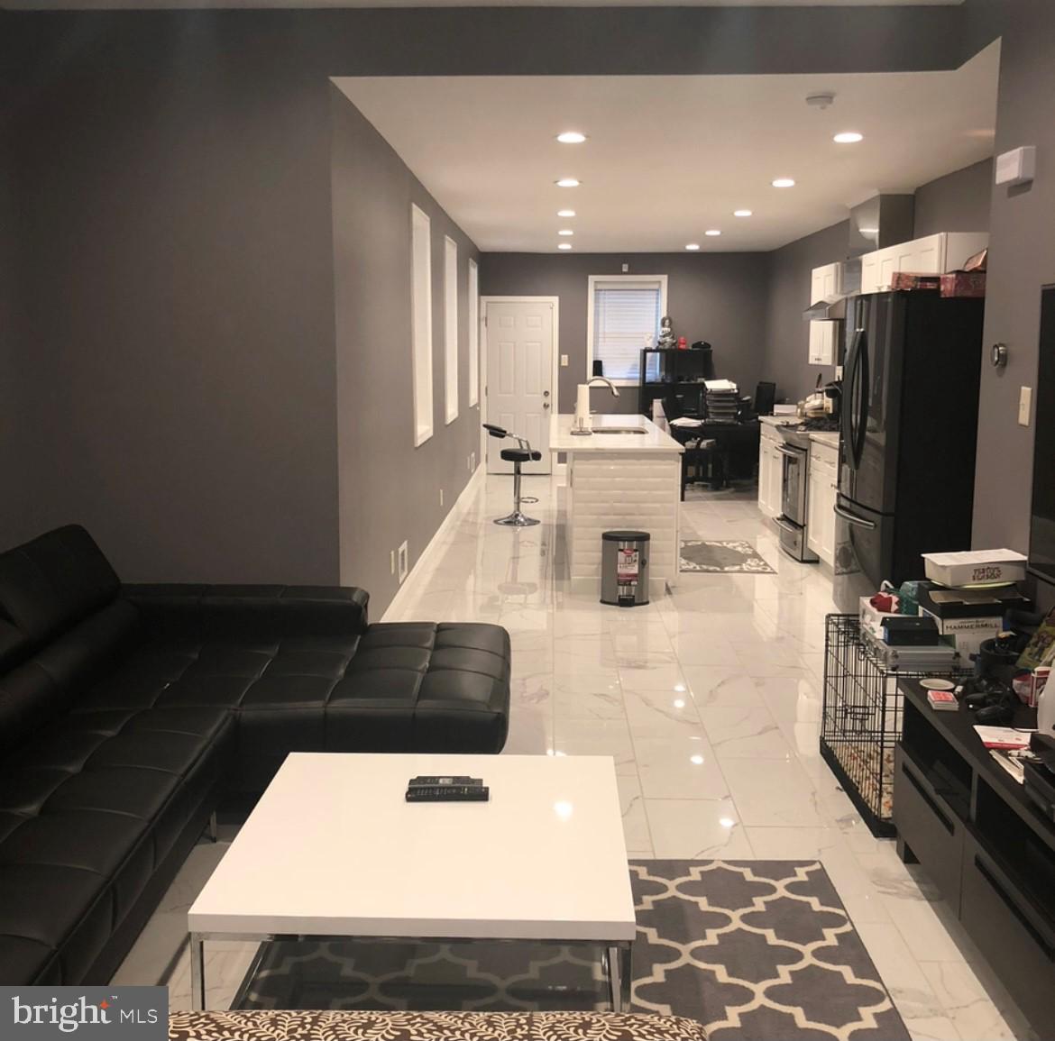 2227 Tasker Street Philadelphia, PA 19145 - Photo 1 of 10 Living room view when the property was furnished.