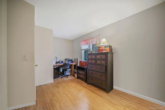 a bed room with a bed and a television