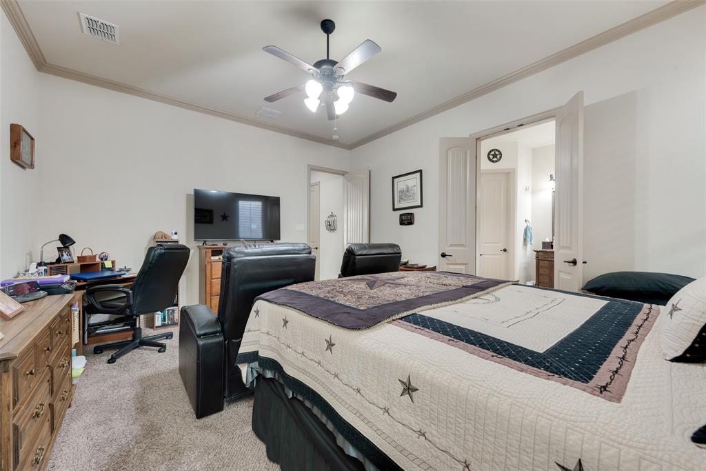 5056 Empire Way Irving, TX 75038 - Photo 14 of 40 a bedroom with a bed and a chandelier