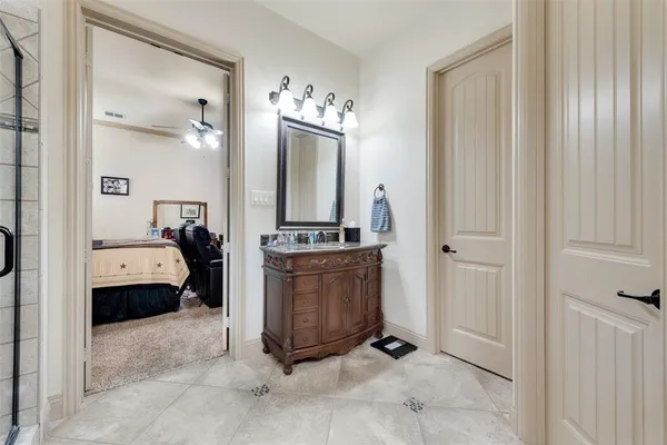 a view of bathroom with tub and mirror