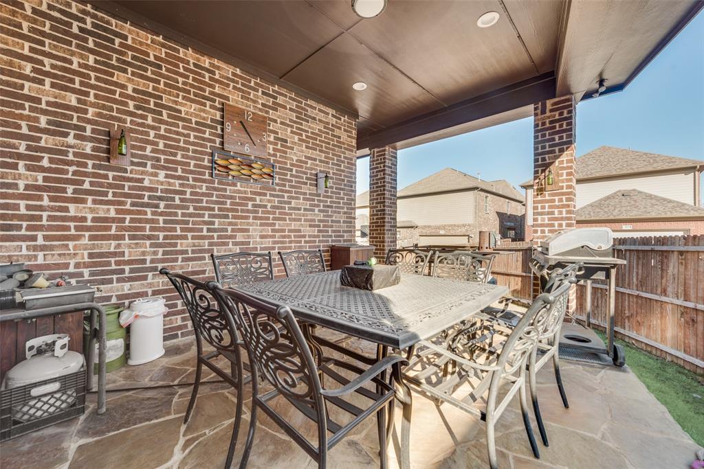 5056 Empire Way Irving, TX 75038 - Photo 33 of 40 a view of a dining room with furniture and a large window