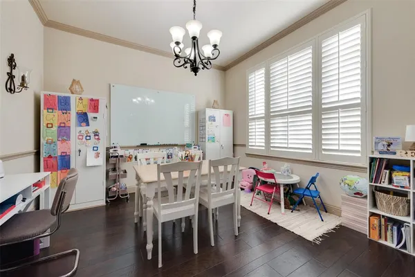 a view of a dining room with furniture and a window
