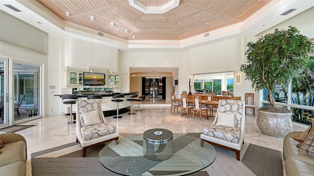 510 Harbor Gate Way Longboat Key, FL 34228 - Photo 11 of 98 a living room with furniture and a fireplace