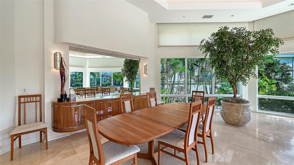 510 Harbor Gate Way Longboat Key, FL 34228 - Photo 15 of 98 a view of a dining room with furniture window and outside view