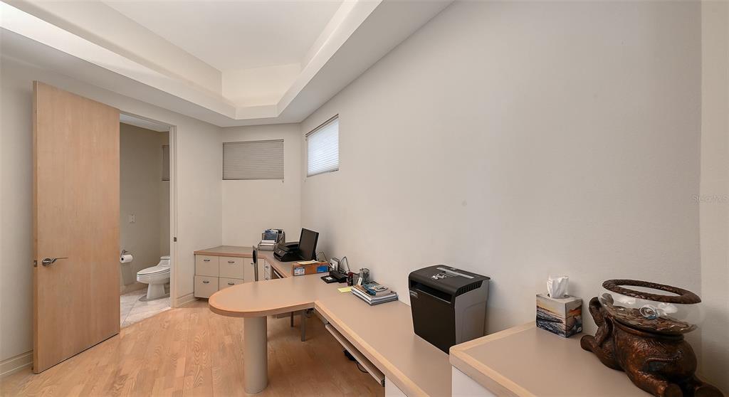 510 Harbor Gate Way Longboat Key, FL 34228 - Photo 28 of 98 a bathroom with a toilet a sink and mirror