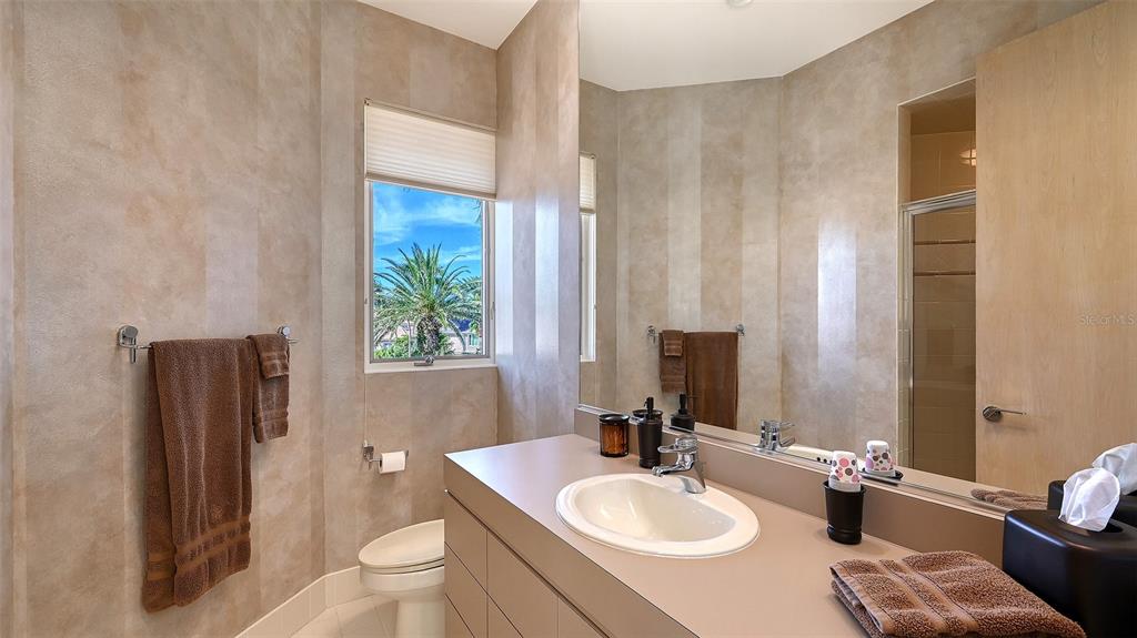 510 Harbor Gate Way Longboat Key, FL 34228 - Photo 44 of 98 a bathroom with a sink toilet and tub