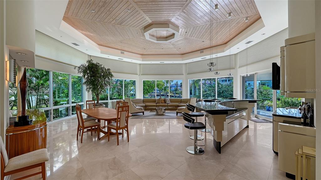 510 Harbor Gate Way Longboat Key, FL 34228 - Photo 5 of 98 a living room with patio furniture and a large window
