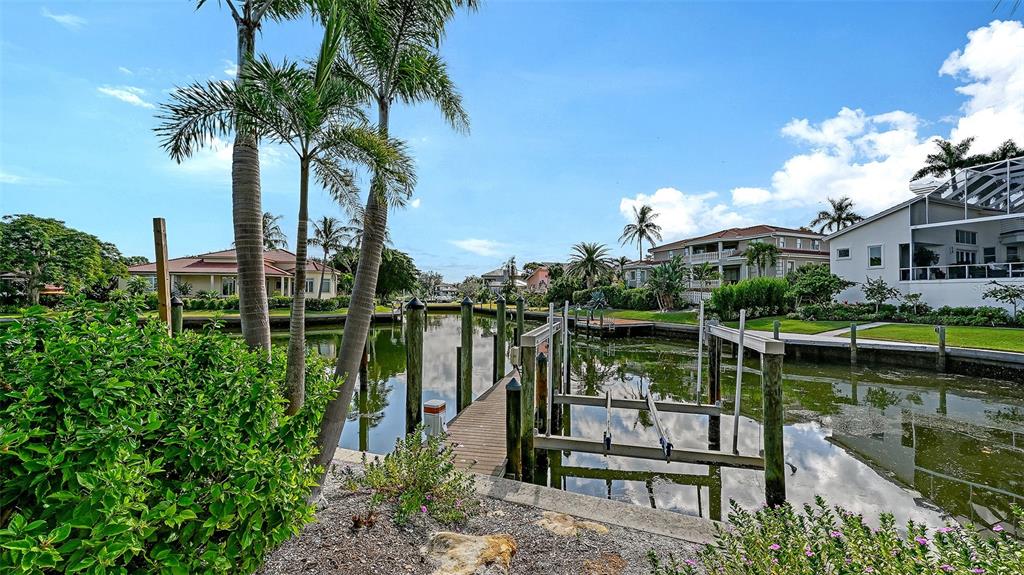 510 Harbor Gate Way Longboat Key, FL 34228 - Photo 75 of 98 a view of a lake with a house in the background