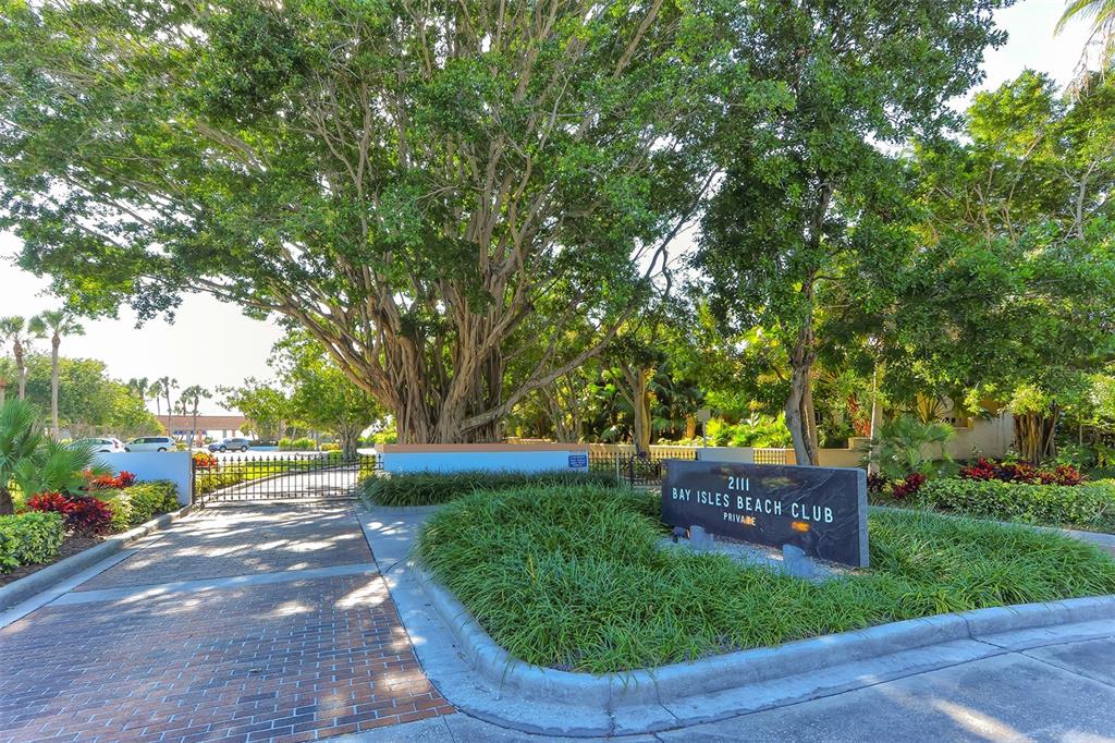 510 Harbor Gate Way Longboat Key, FL 34228 - Photo 93 of 98 a view of a garden with a bench