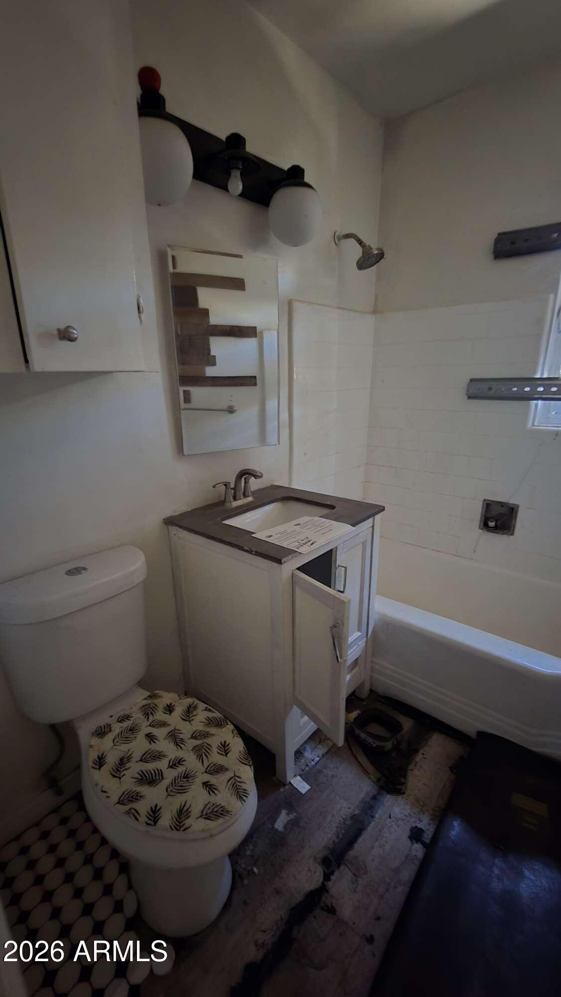 834 West Osborn Road Phoenix, AZ 85013 - Photo 41 of 45 a bathroom with a sink a toilet and a bathtub