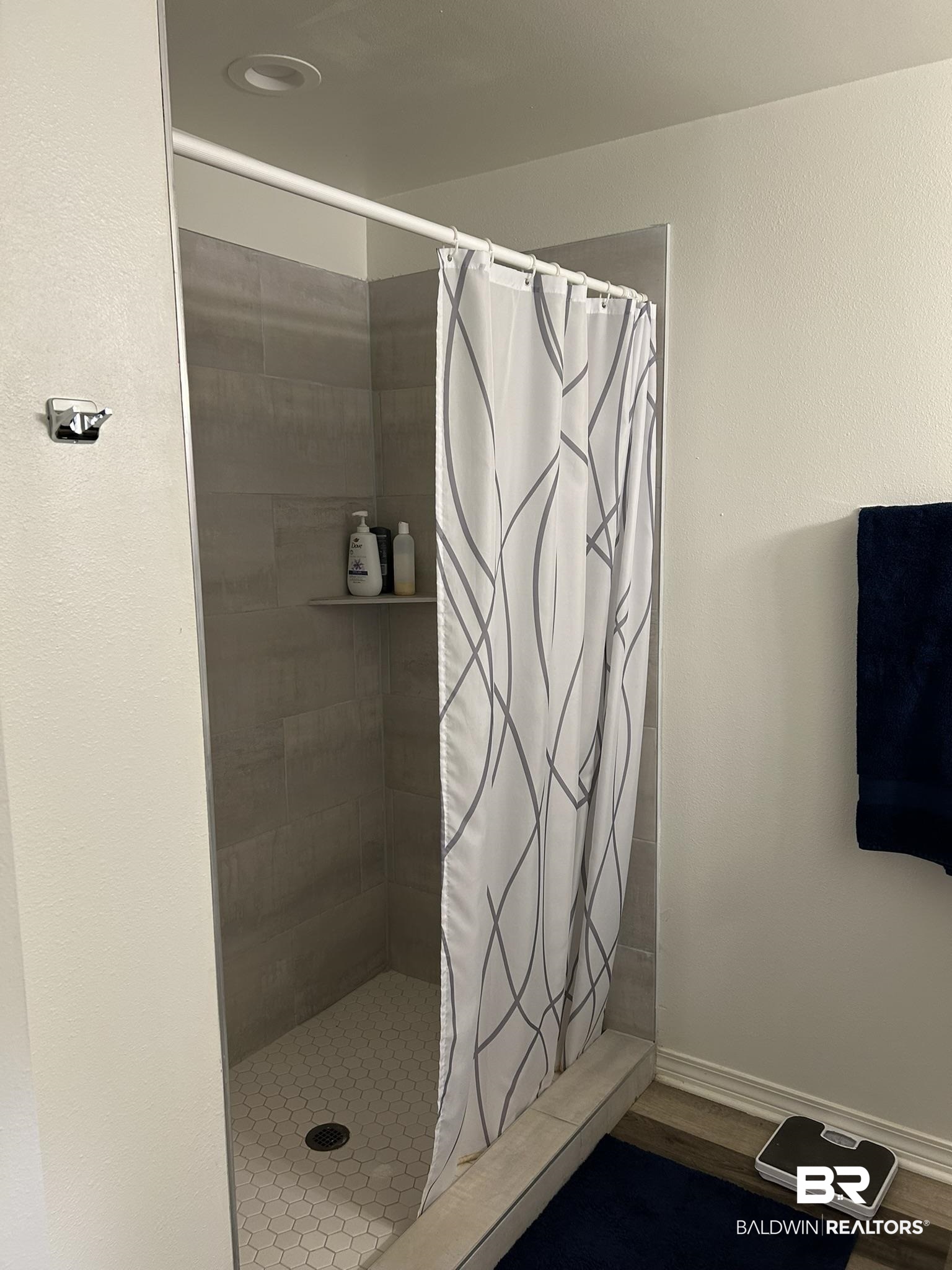 2 Canterberry Circle Foley, AL 36535 - Photo 13 of 24 Bathroom featuring a stall shower, baseboards, and wood finished floors
