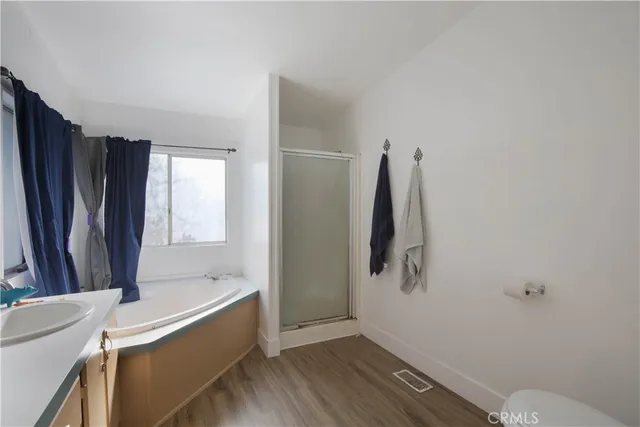 a bathroom with a tub and a sink